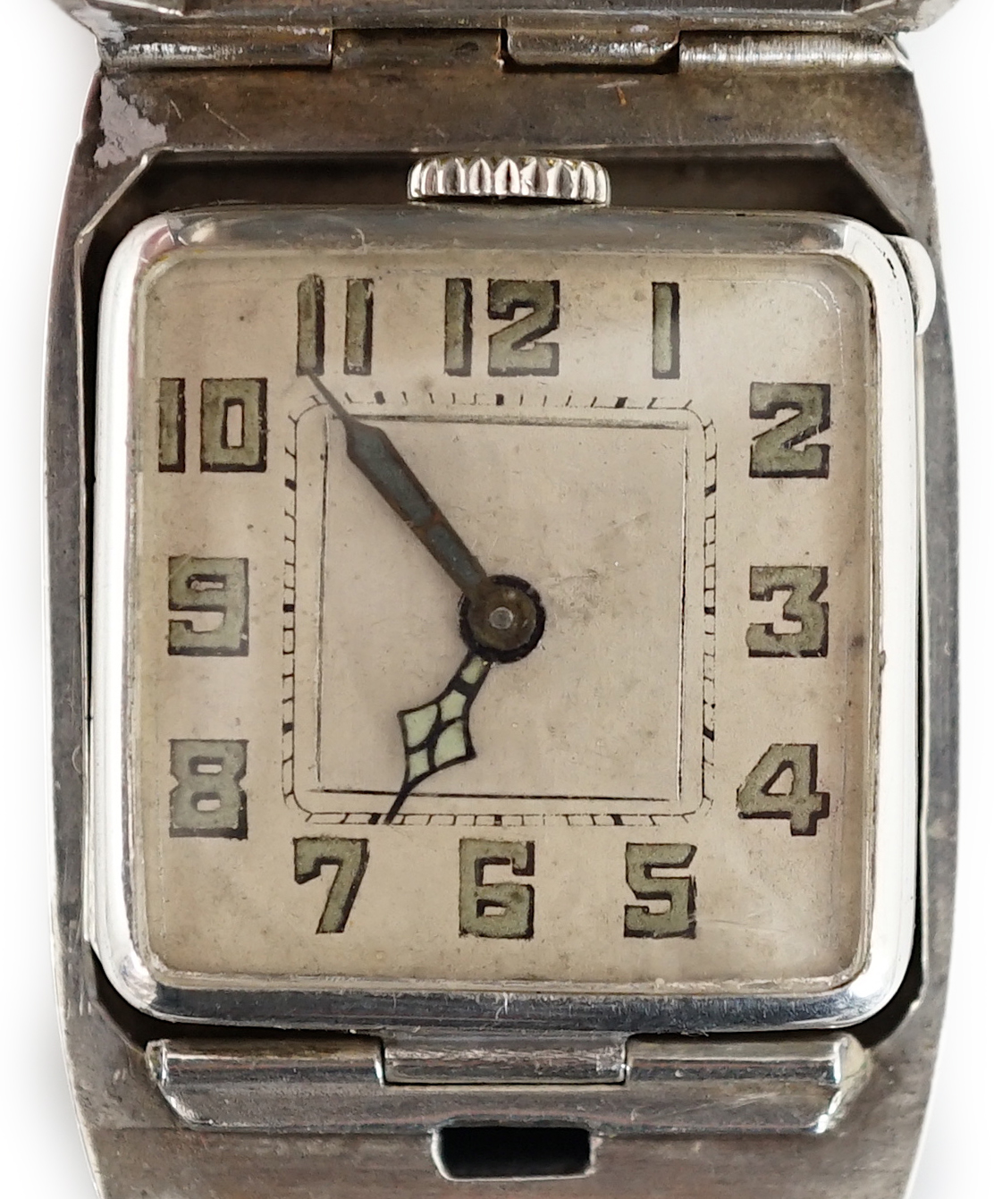 A gentleman's late 1920's silver flip action manual wind rectangular wrist watch